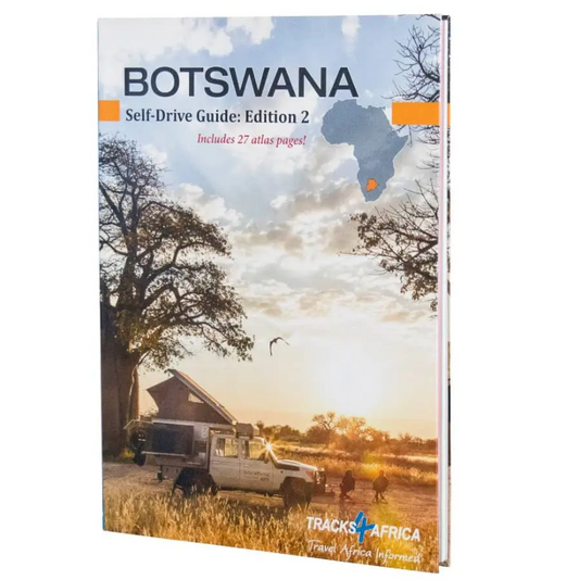 Cover of the 'Botswana Self-Drive Guide Book: Edition 2' featuring a sunset landscape with a silhouette of a vehicle in the foreground.