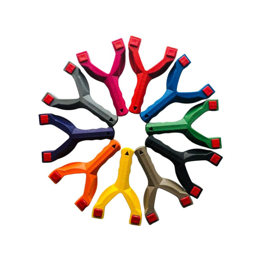 A collection of colourful slingshots arranged in a circle, in a variety of solid colors.