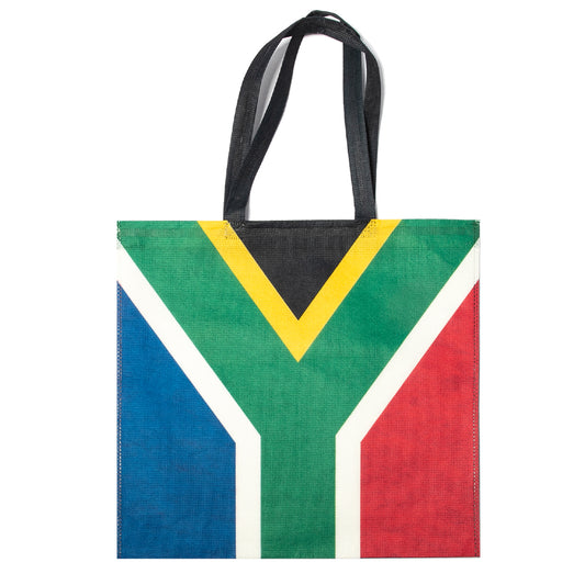 A shopping bag with the South African flag printed on it, featuring two handles and a flat base.