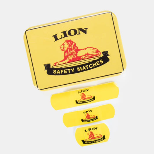 Yellow box of Lion safety matches with four match sticks on a white background