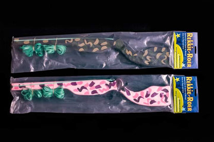 Two toy guns with  camouflage pattern in their packaging.